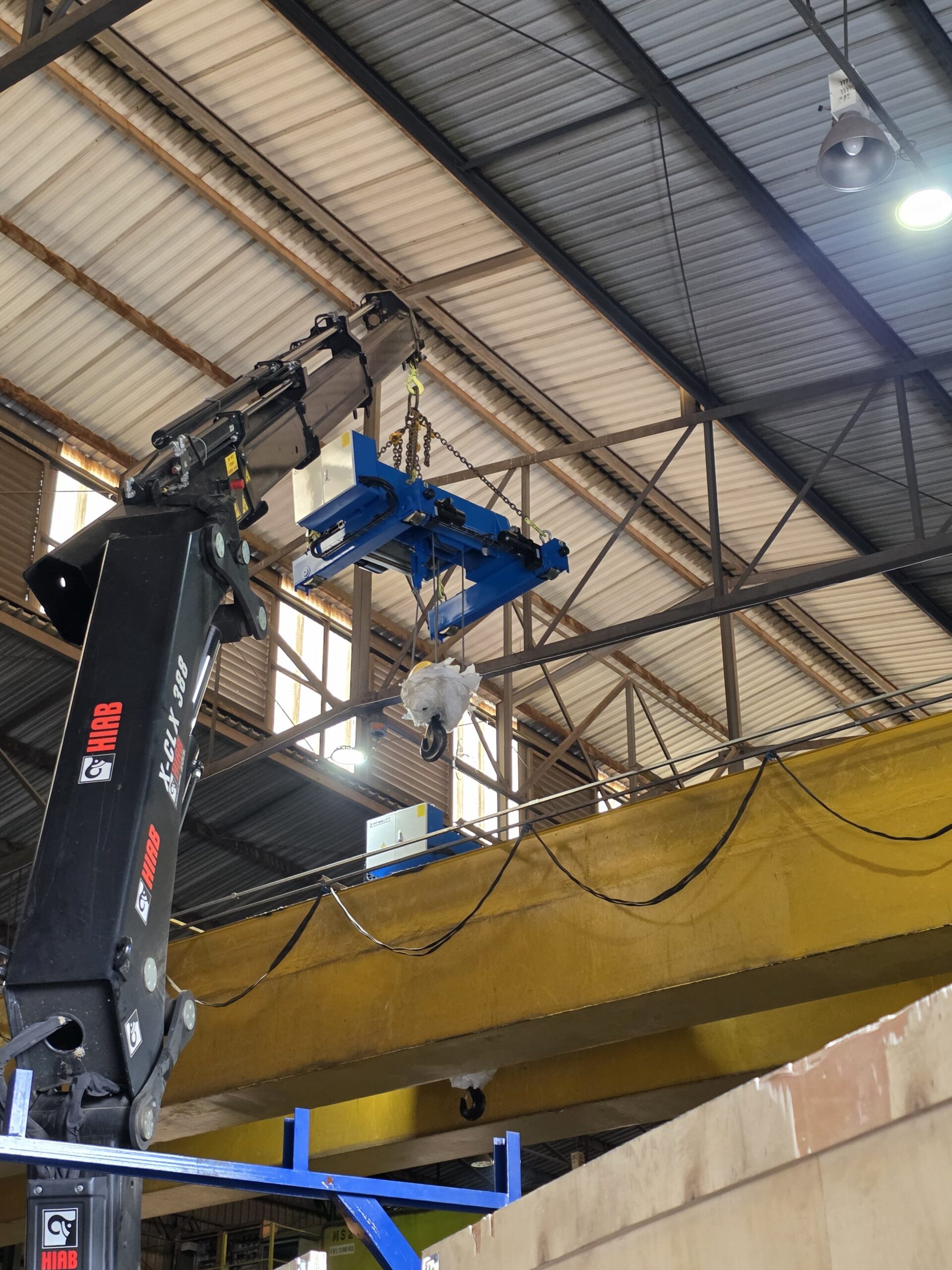Installation of new overhead crane hoists using a crane truck
